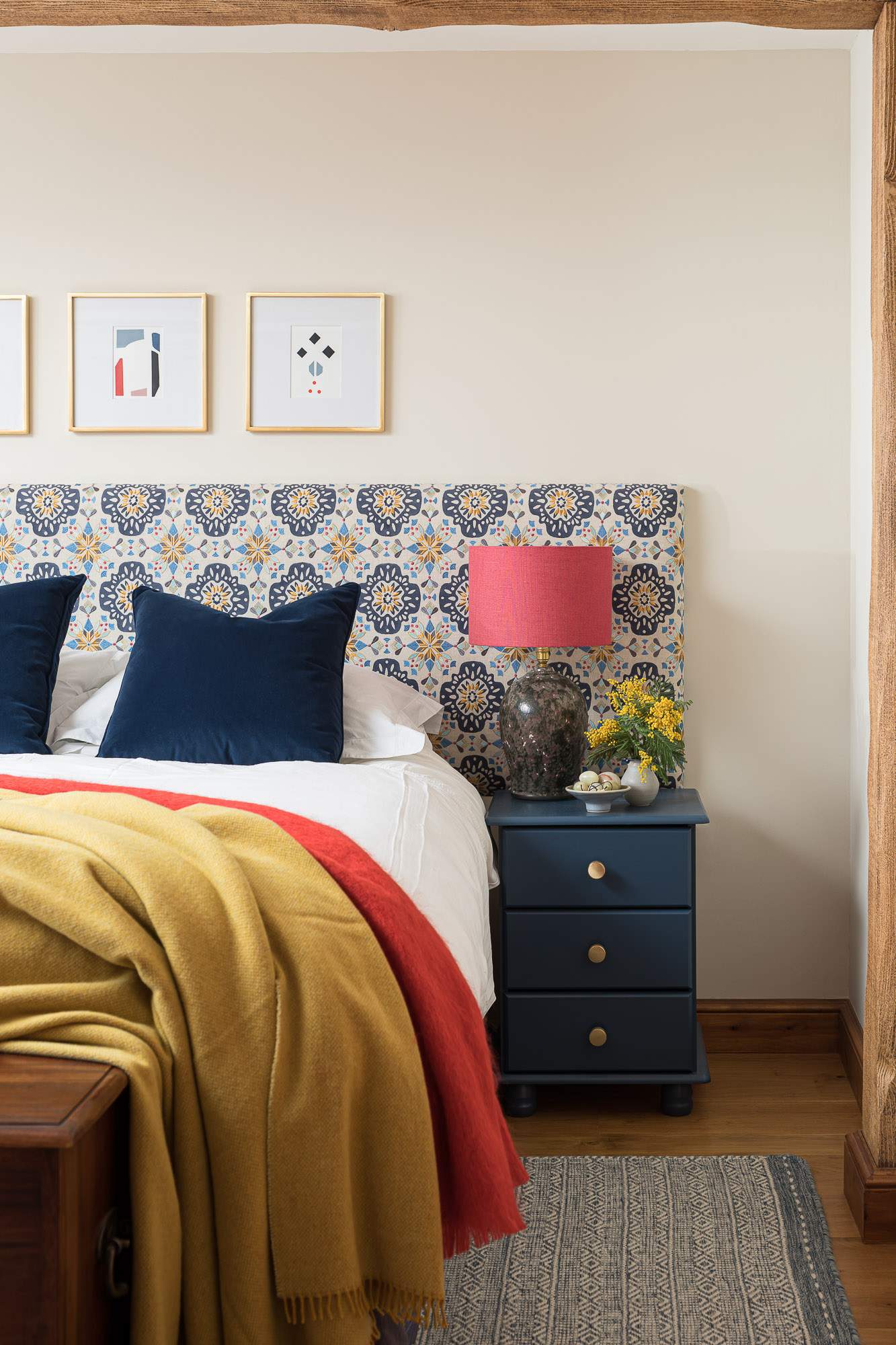 Bedroom with embroidered headboard