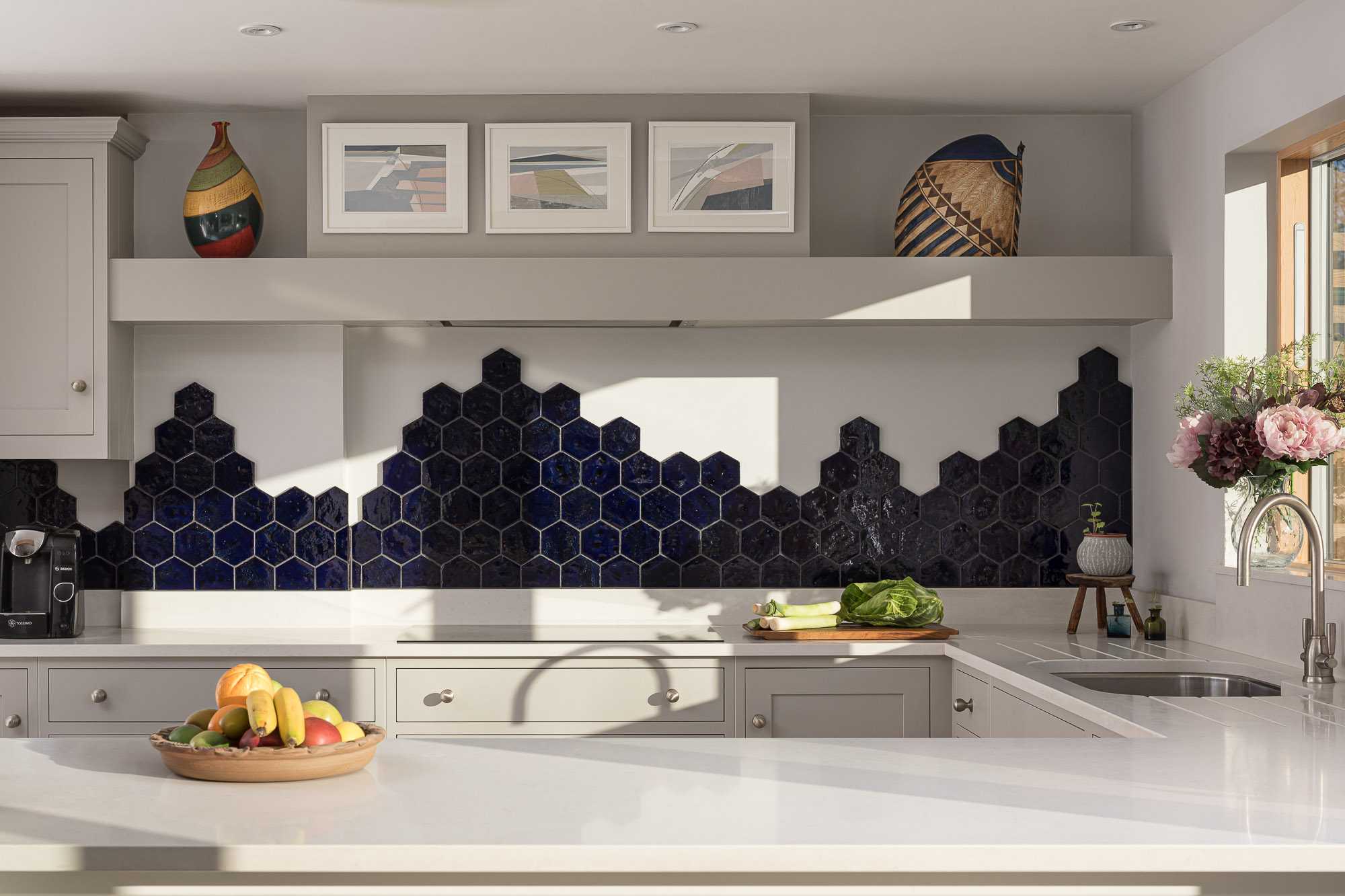 Shaker kitchen in dove grey with blue hexagon tiles