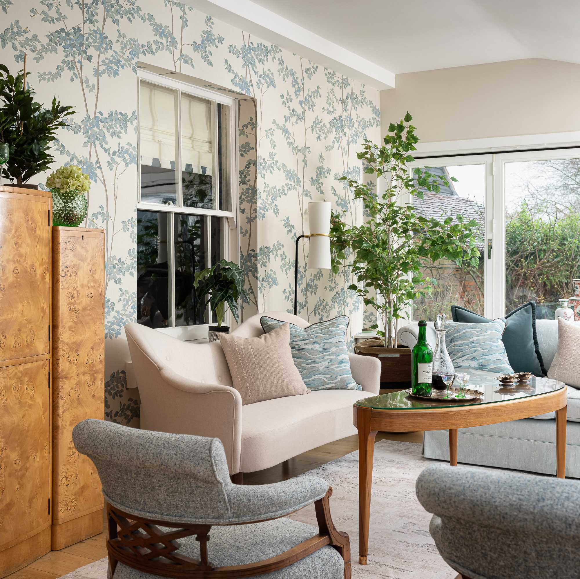 Garden room with curved vintage sofa